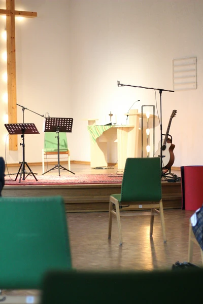Wedding musician setting up PA equipment in a church before the ceremony